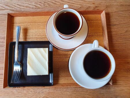 two black coffees in a white cupの写真素材