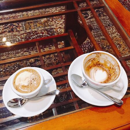 one coffee milk with one cup that has been drunkの写真素材
