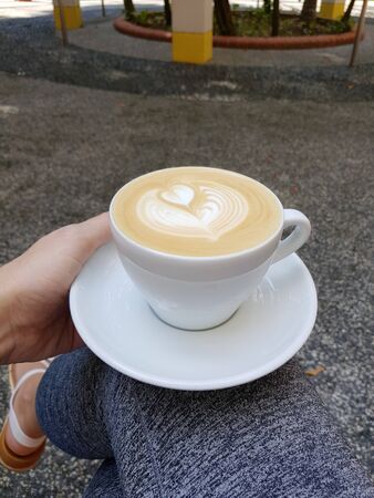 cappuccino with heart shape in a cup with motion blurの写真素材