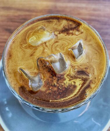 iced milk coffee in a glass with motion blurの写真素材
