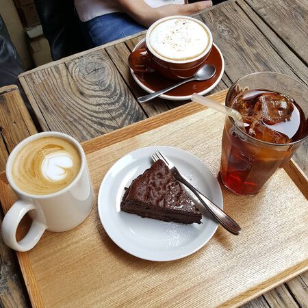 chocolate brownies with three coffee milk in a cupの写真素材
