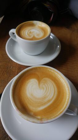 milk coffee with heart shape from milk with motion blurの写真素材
