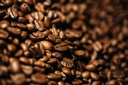 coffee beans in large quantities with motion blurの写真素材