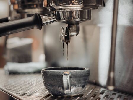 machine makes steel coffee with motion blurの写真素材