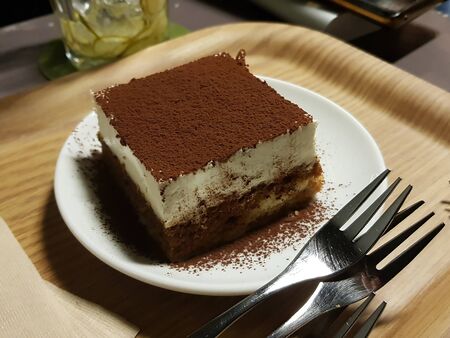 snack with chocolate powder on it on a plateの写真素材