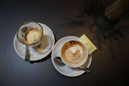 coffee with ice cream in a glass on a plain tableの写真素材