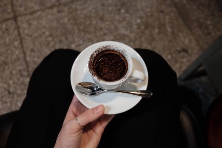Chocolate coffee with chocolate powder on a cupの写真素材