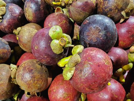purple fruit in a fruit basketの写真素材