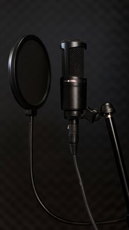 many black decoration Stacked on a dark background on black wallの写真素材