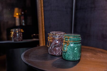 black decoration and white bottle stone Stacked on a dark background on gray floor and gray tableの写真素材