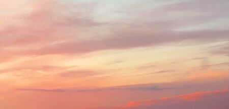 orange sky and sunrise colored wide sky and gradient and white cloud texture and striped abstract dirty backgroundの写真素材