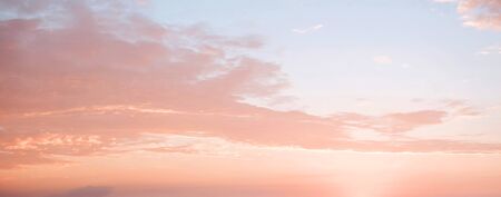 orange sky and sunrise colored wide sky and gradient and white cloud texture and striped abstract dirty backgroundの写真素材