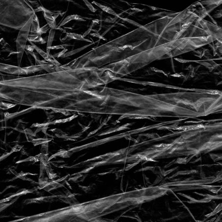 white many plastic texture and clear plastic black background transparent plastic wrap on the black...