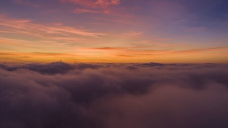 orange sky and gray cloud sky dramatic Panorama mountain and dramatic sky sunrise background and Beautiful colorful sunrise over mountainの写真素材