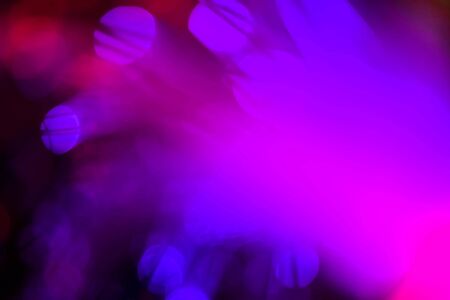 light purple neon light abstract Neon bright lens flare colored on black background.dark abstract...