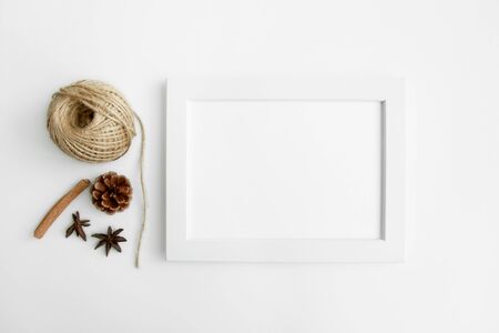 white wall and dark tree decoration Modern frames desk home decoration with frame photo and mock up white frame and dry twigs in vase on book shelf or desk in white roomの写真素材