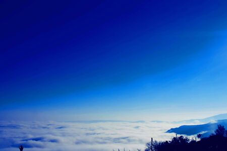blue sunset sky and beautiful blue sky background with clouds and sunlight beams on background