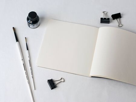 desk organizer notebook,black pen, planner or organizer, mark on white table on background
