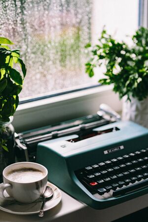 black cup coffee is the place to see various tropical and on brown wooden background.の写真素材