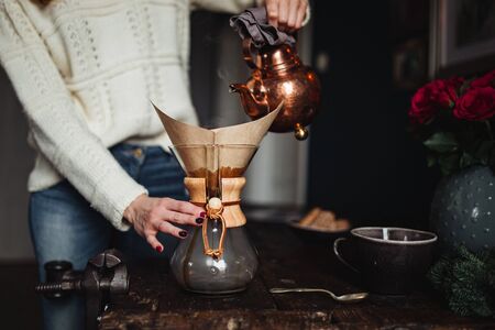 black cup coffee is the place to see various tropical and on brown wooden background.の写真素材