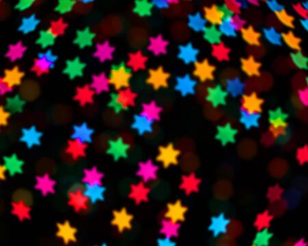 rainbow colorful blur christmas lights background.abstract Lights unfocused blur light dots black background.の写真素材