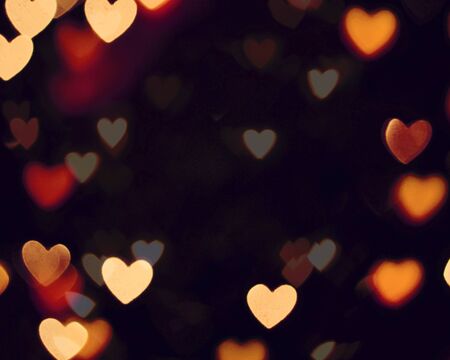 orange blur christmas lights background.abstract Lights unfocused blur light dots black background.の写真素材