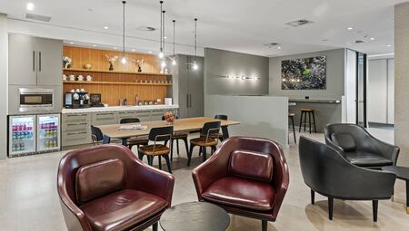 Co working space center modern workplace interior on brown chair,black and gold table, laptop on modern design backgroundの写真素材