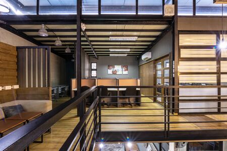 co working space modern style room with wood brown chair,brown table stylish room with soft lamp on backgroundの写真素材