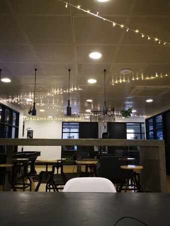 co working space modern style room with wood brown chair,brown table stylish room with soft lamp on backgroundの写真素材