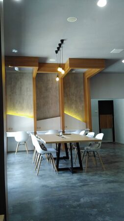 co working space modern white chair,white and brown table, with interior space area working at...