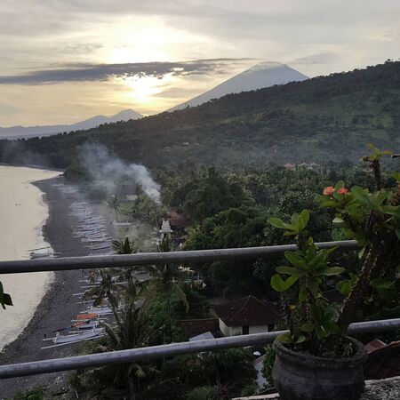 orange light beautiful sunset view sky above blue clouds with dramatic light on paradise tropical ocean islandの写真素材