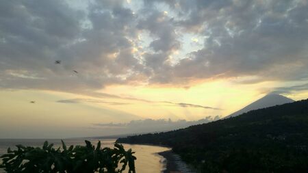 orange light beautiful sunset view orange clouds with dramatic light on paradise tropical ocean...