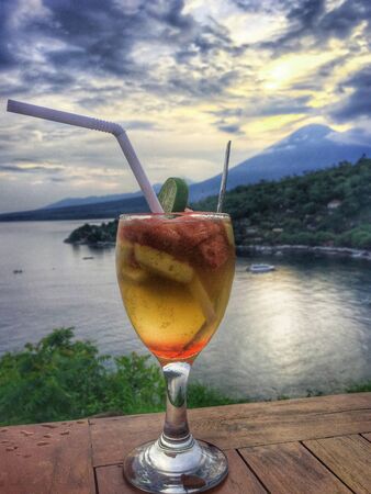 blue sky beautiful sunset view orange clouds with dramatic light on paradise tropical ocean islandの写真素材