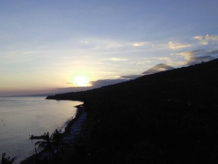 beautiful sunset view sky above orange clouds with dramatic light on paradise tropical ocean island
