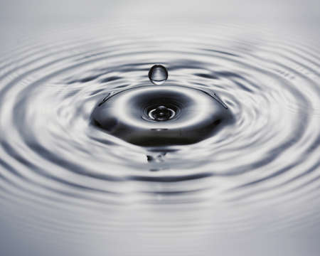 blue transparent water wave splash abstract with water bubbles on blue background.の写真素材
