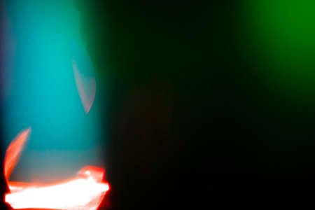 abstract dark neon glowing futuristic light with glow in the dark pattern on dark background.の写真素材