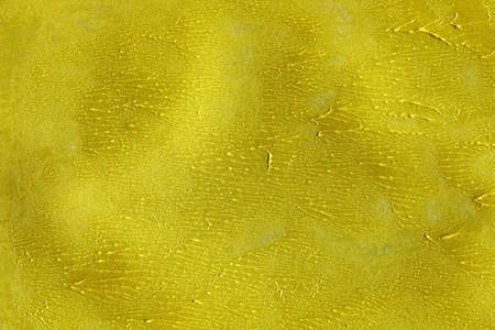 gold paint texture abstract elegant antique and gold surface ink spatter on gold background.の写真素材