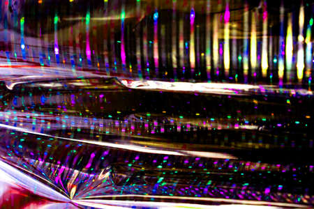 purple and colorful neon abstract texture dark circle colorful light pattern on black background.の写真素材
