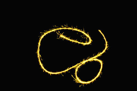 abstract gold sparkler overlays texture elegant surface pattern on black background.の写真素材