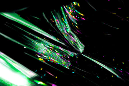 neon light green abstract texture dark circle colorful light pattern on black background.の写真素材