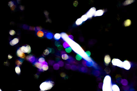 light blue neon abstract texture dark circle colorful light pattern on black background.の写真素材