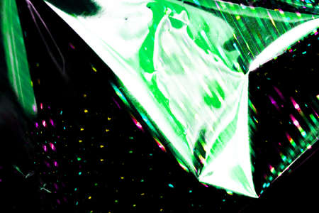 neon light green abstract texture dark circle colorful light pattern on black background.の写真素材