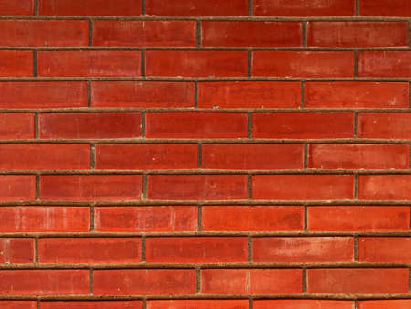 abstract dark red grunge brick wall texture with grungy rusty stone vintage brick wall pattern on light red background.の写真素材