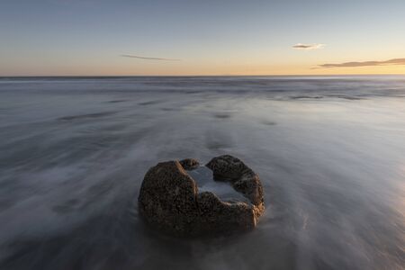 One  the Moeraki Boulders at sunrise  a colourful sky, New Zealand.の写真素材