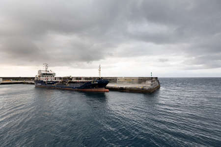 Vessel named Sao Jorge of Transinsular in the port of Sao Roque, Pico Island. This service comprises...