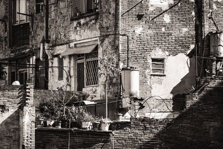 Backyards, balconies and windows of modest old brick houses - Black and Whiteの写真素材