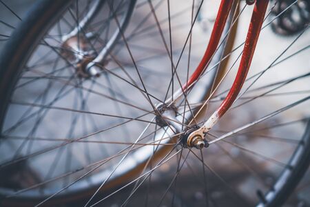 Front wheels, spokes and forks of a couple vintage bicyclesの写真素材