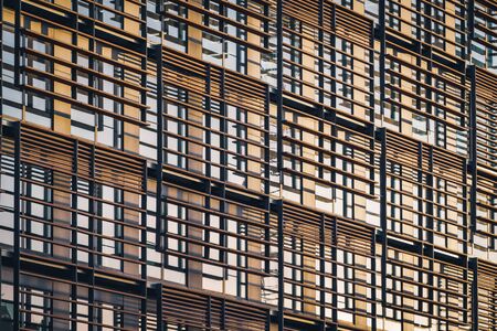 Geometric facade of a minimalist building under the last afternoon lightsの写真素材