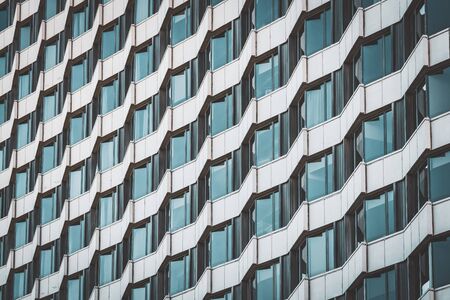 Irregular facade of an urban building creating a patternの写真素材