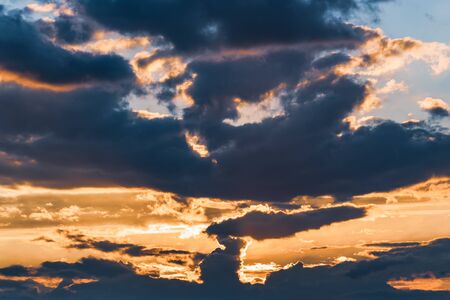 Dramatic landscape of the last lights among the clouds of twilightの写真素材